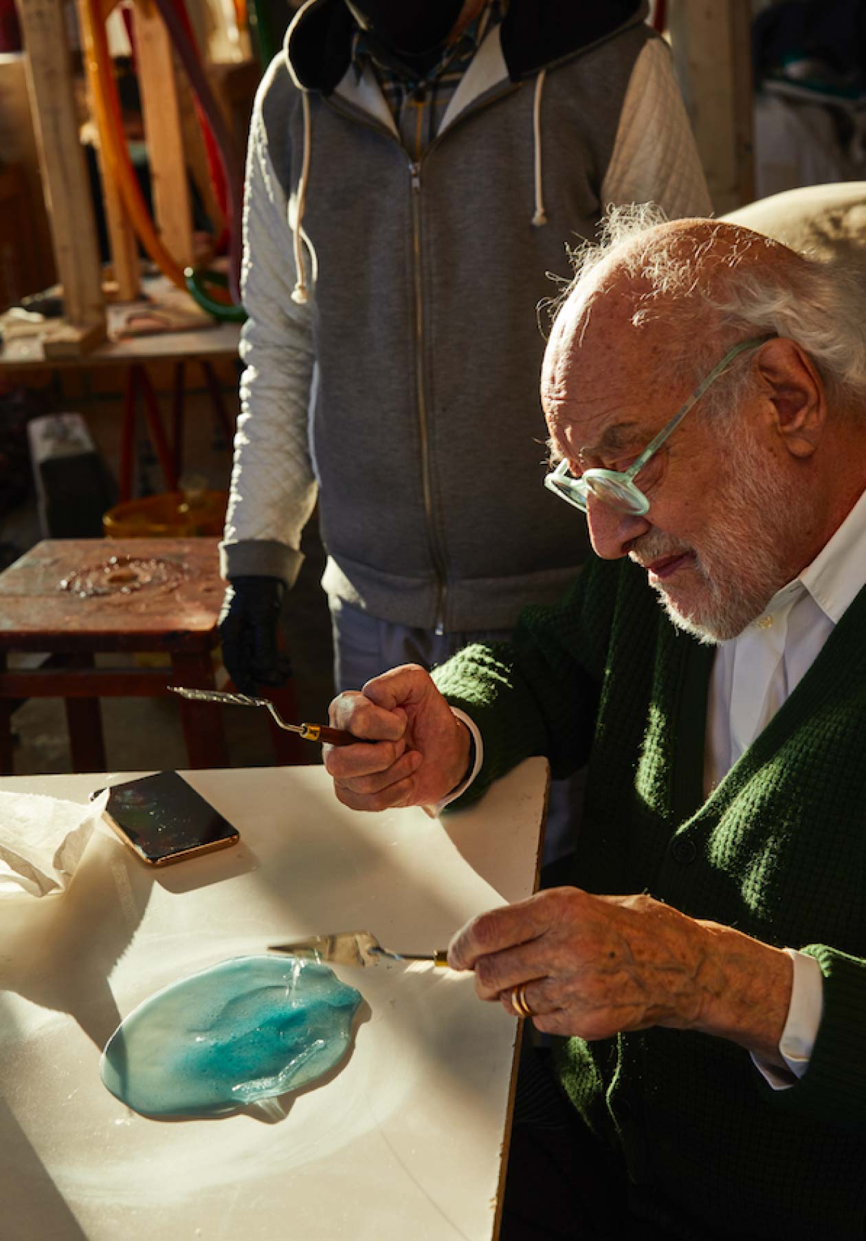 Man Manipulating A Melted Blue Texture